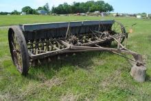 John Deere Van Brunt 12' grain drill with grass seeder, on steel, has been shedded and everything wo