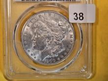 PCGS 1900 Morgan Dollar in About Uncirculated 58