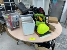 Contents of Table - Hard Hats - Boots - Back Packs & More - Please see pics for additional specs.
