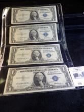 (4) Series 1935F One Dollar Silver Certificates in a plastic page.