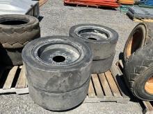 (4) Solid Skid Steer Tires