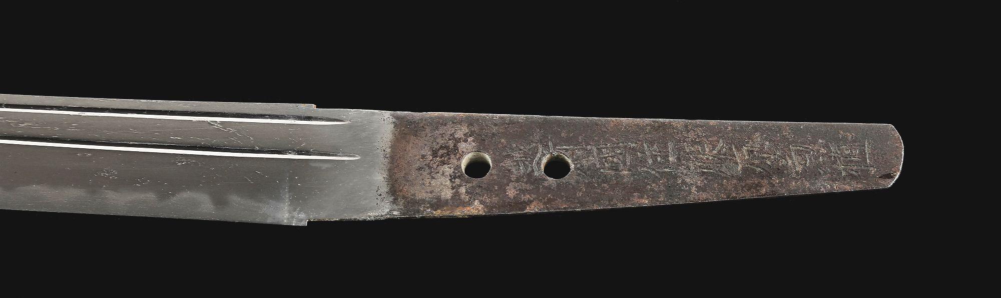 A LARGE TANTO SIGNED BY ECHIZEN KANETANE, WITH AN UNUSUAL INSCRIPTION REGARDING FORGING, IN KOSHIRAE