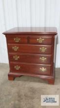 Cherry nightstand made by Knob Creek. 29 in. tall by 27 in. long by 18 in. deep.