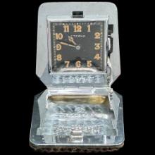 Circa 1936 Swiss Eterna travel clock in a hinged lizard skin