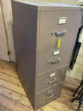 Four drawer metal file cabinet with key