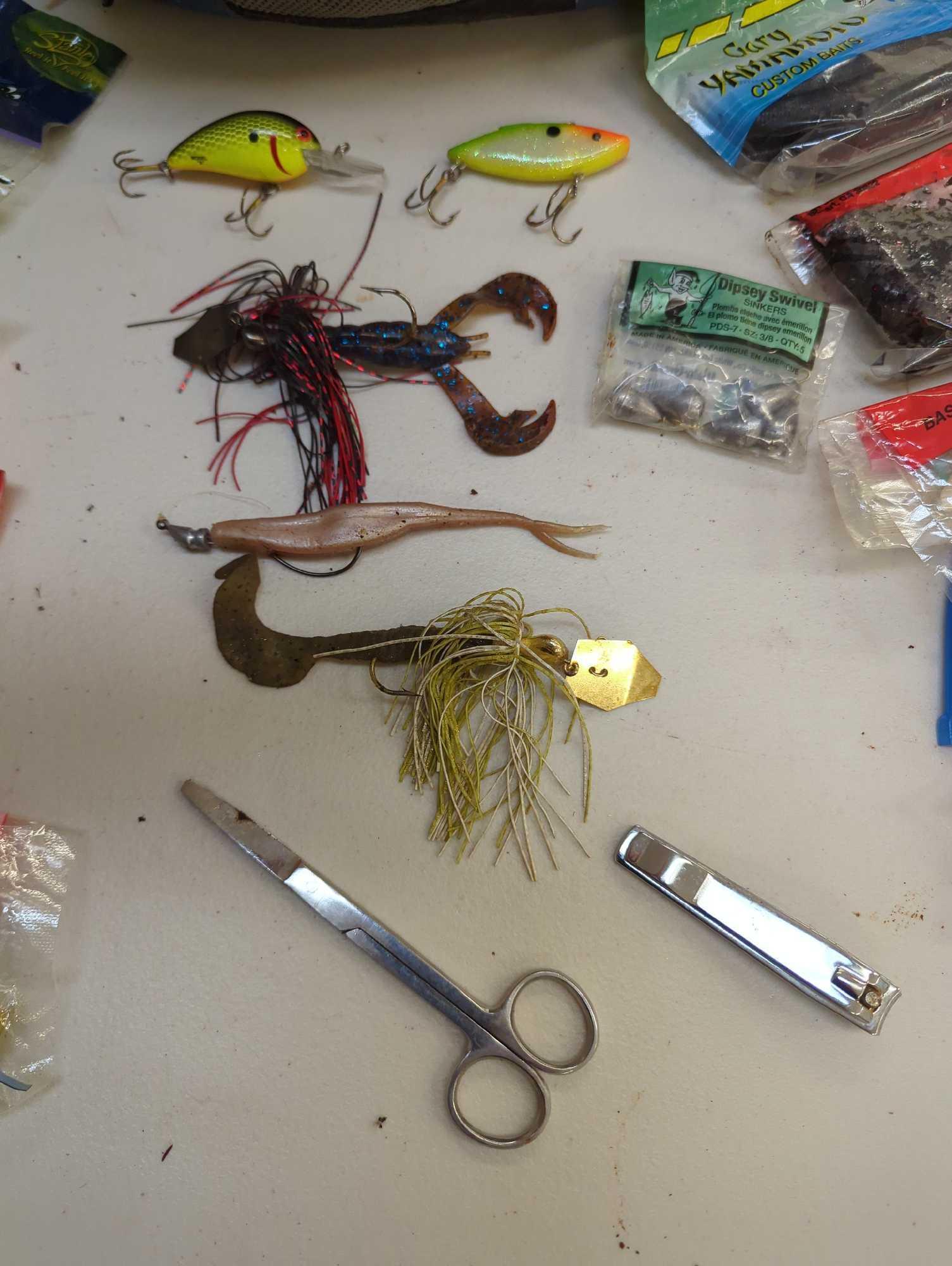 Okeechohee Fats bag and contents including various worm fishing lures and other various fishing