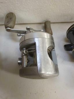 ProPak foam cooler and contents including various fishing reels. Comes as is shown in photos.