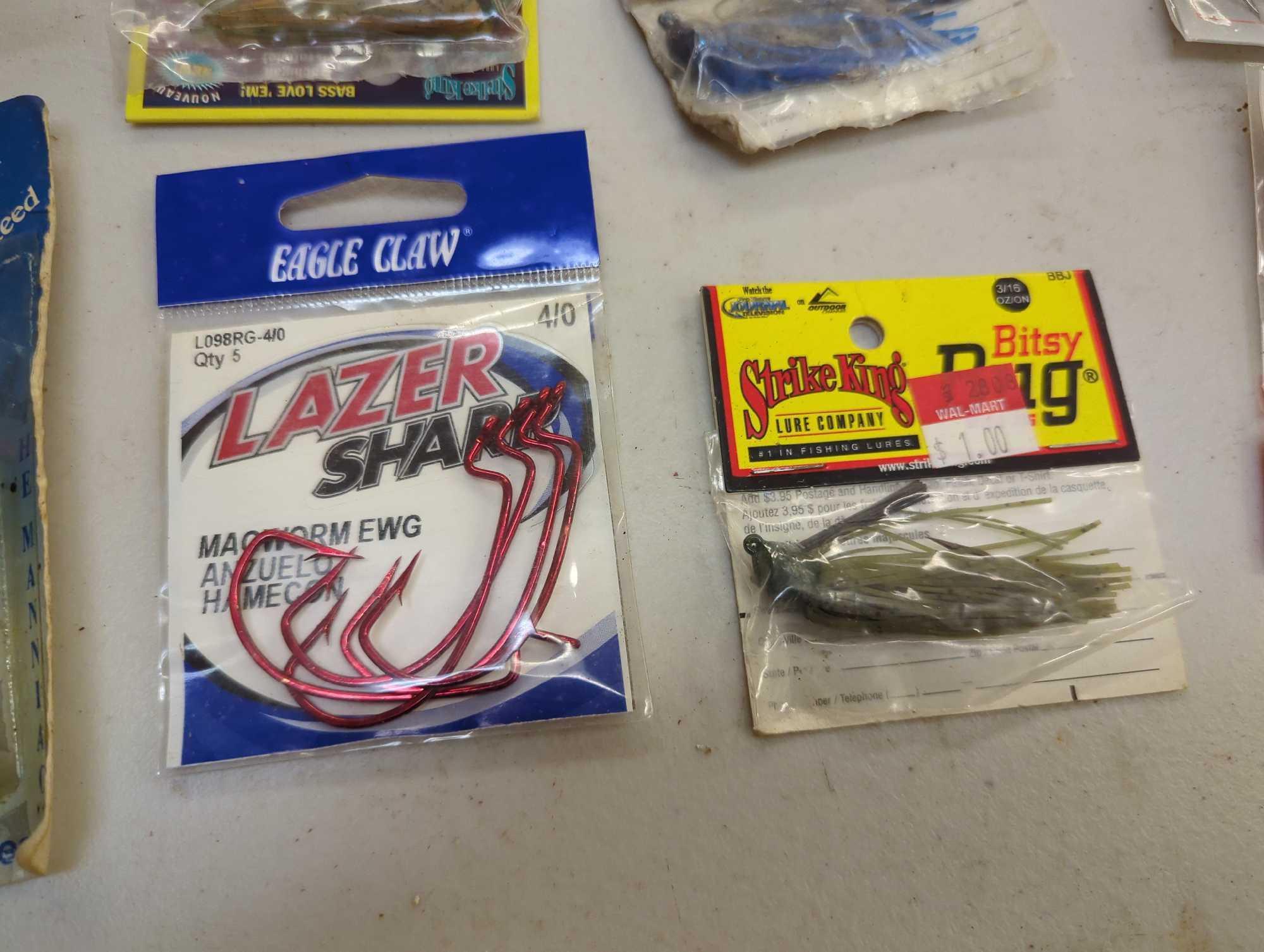 Box and contents including fishing lures and other fishing accessories. Comes as is shown in photos.