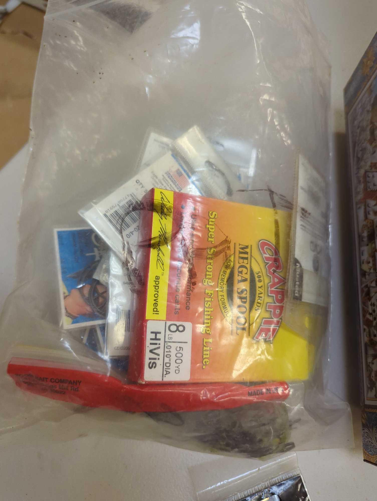 Large tin and contents including various fishing lures and fishing accessories. Comes as is shown in