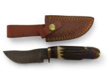 Handmade Damascus steel knives with custom wood, bone, horn or resin handles. The knives are made