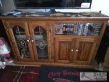 Wooden Entertainment Center with VHS Tapes, Sony Digital Network Recorder, and Sony DVD/VHS Recorder