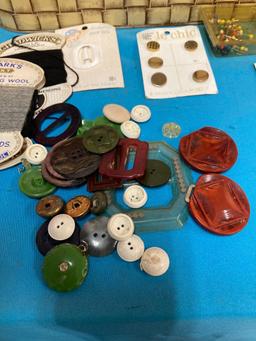 Vintage sewing lot, including Bakelite buttons and new old stock sheets