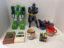 Space toys action figures, electronic baseball and football, Rubiks cube, Flintstone mugs