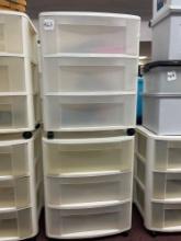 pair of plastic bins with drawers