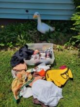 Cement goose lawn ornament with assorted holiday decor outfits