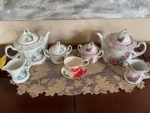 Porcelain treasurers hand painted tea sets, glassware serving pieces, candles, table linens, table