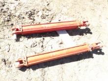 Pair Of Red Hydraulic Cylinders