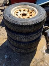 4 OF 205/76/D15 TRAILER TIRES ON RIMS